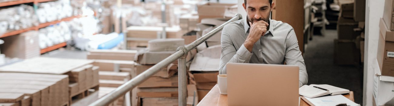 Manager working online while sitting in a warehouse office Types of business structures